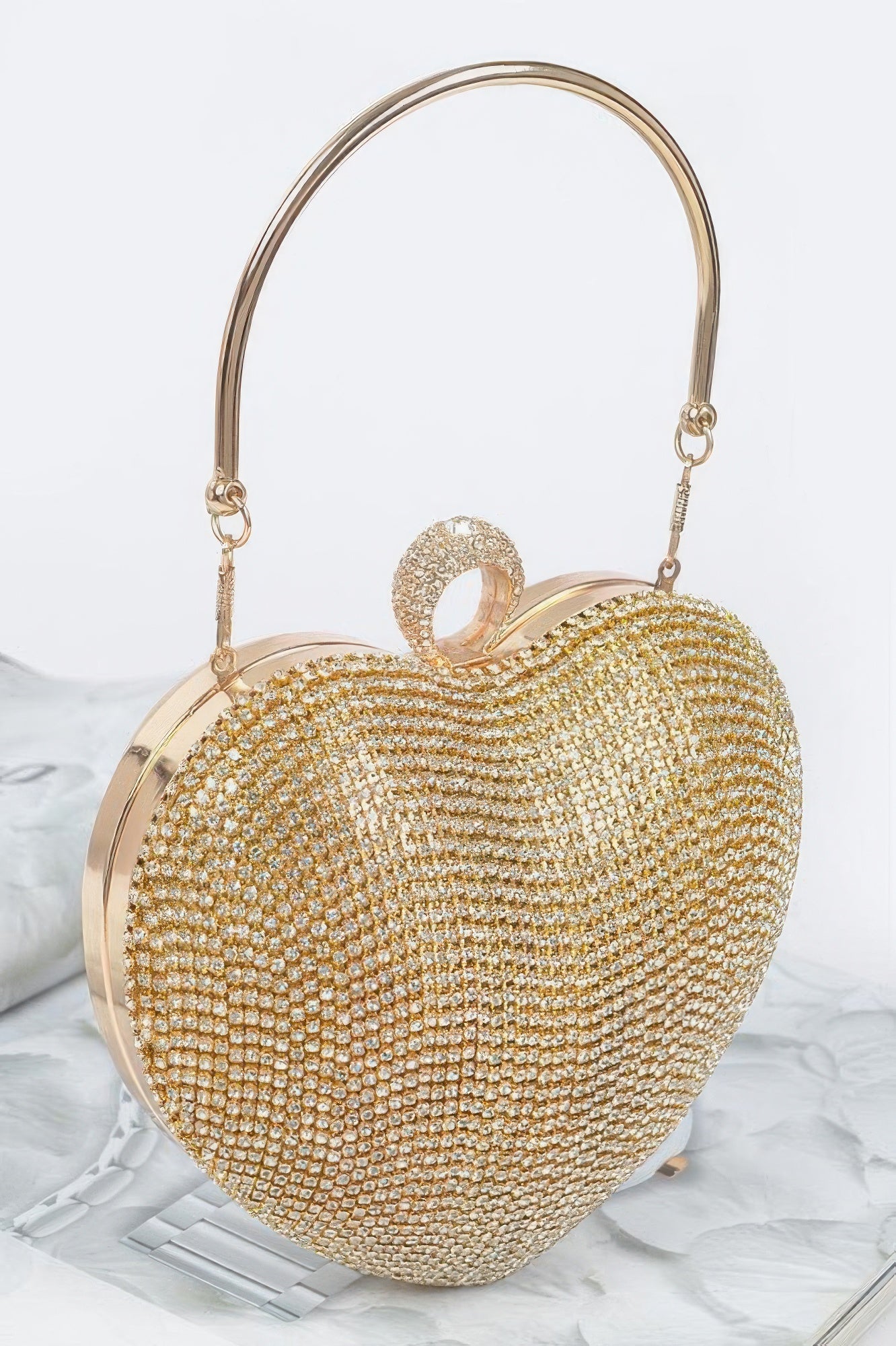 Clear gold rhinestone heart clutch with round top ring handle and shoulder chain