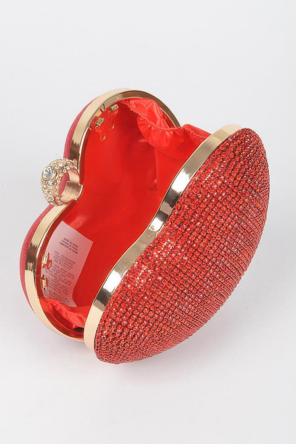 Red rhinestone heart clutch, open top showing satin lining and hinge frame