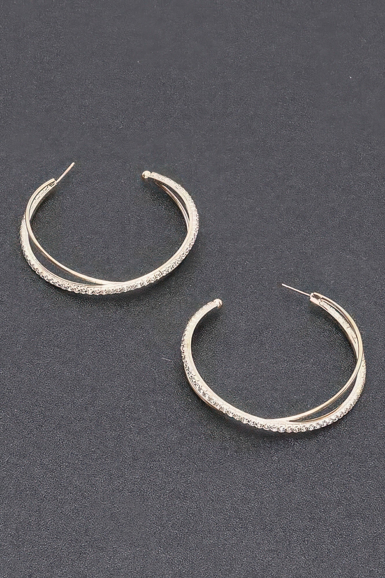 Rhinestone hoop earrings, silver-toned oval hoops with clear stones