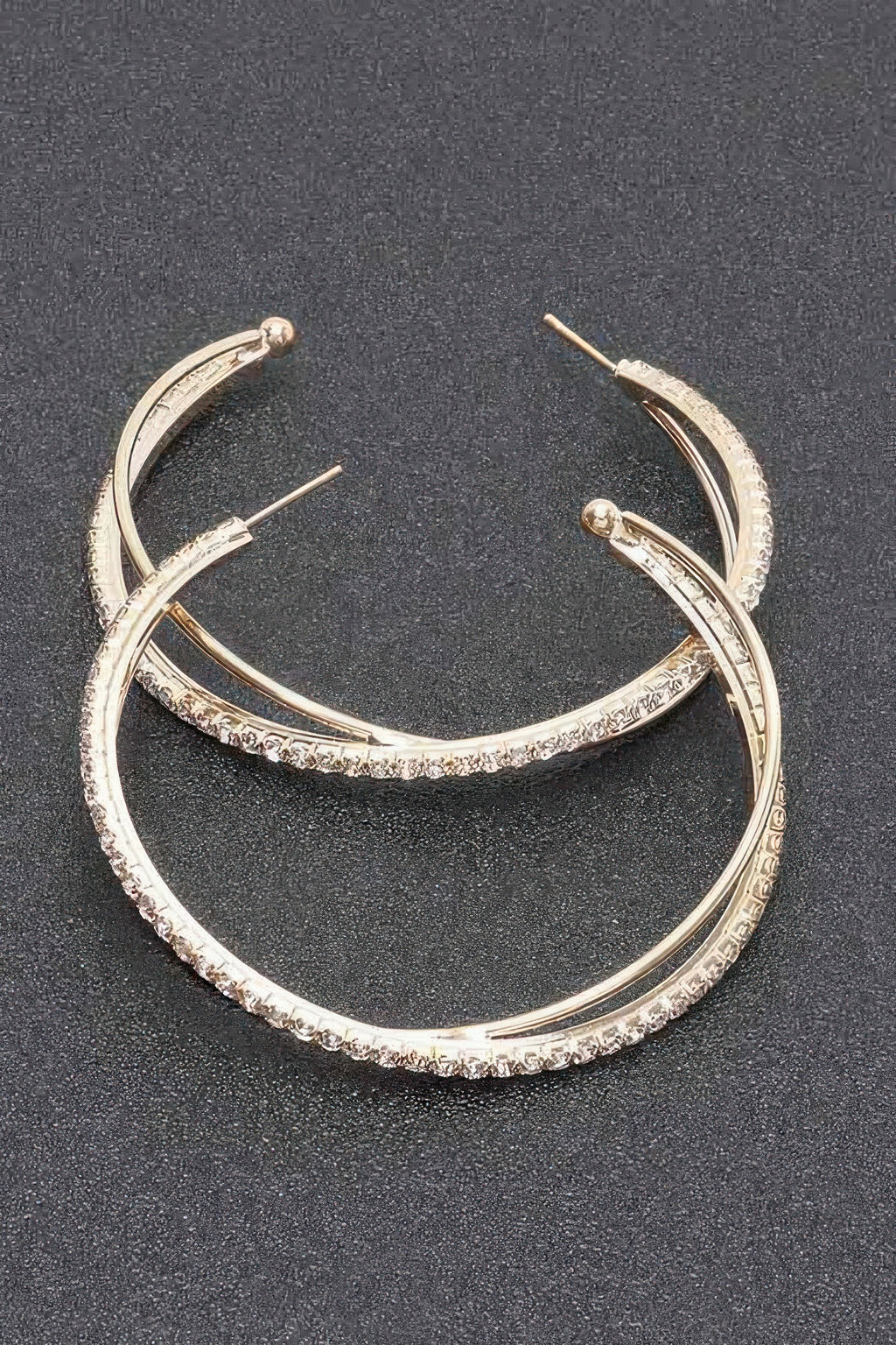 Rhinestone hoop earrings, gold-toned hoops with clear stones across the band