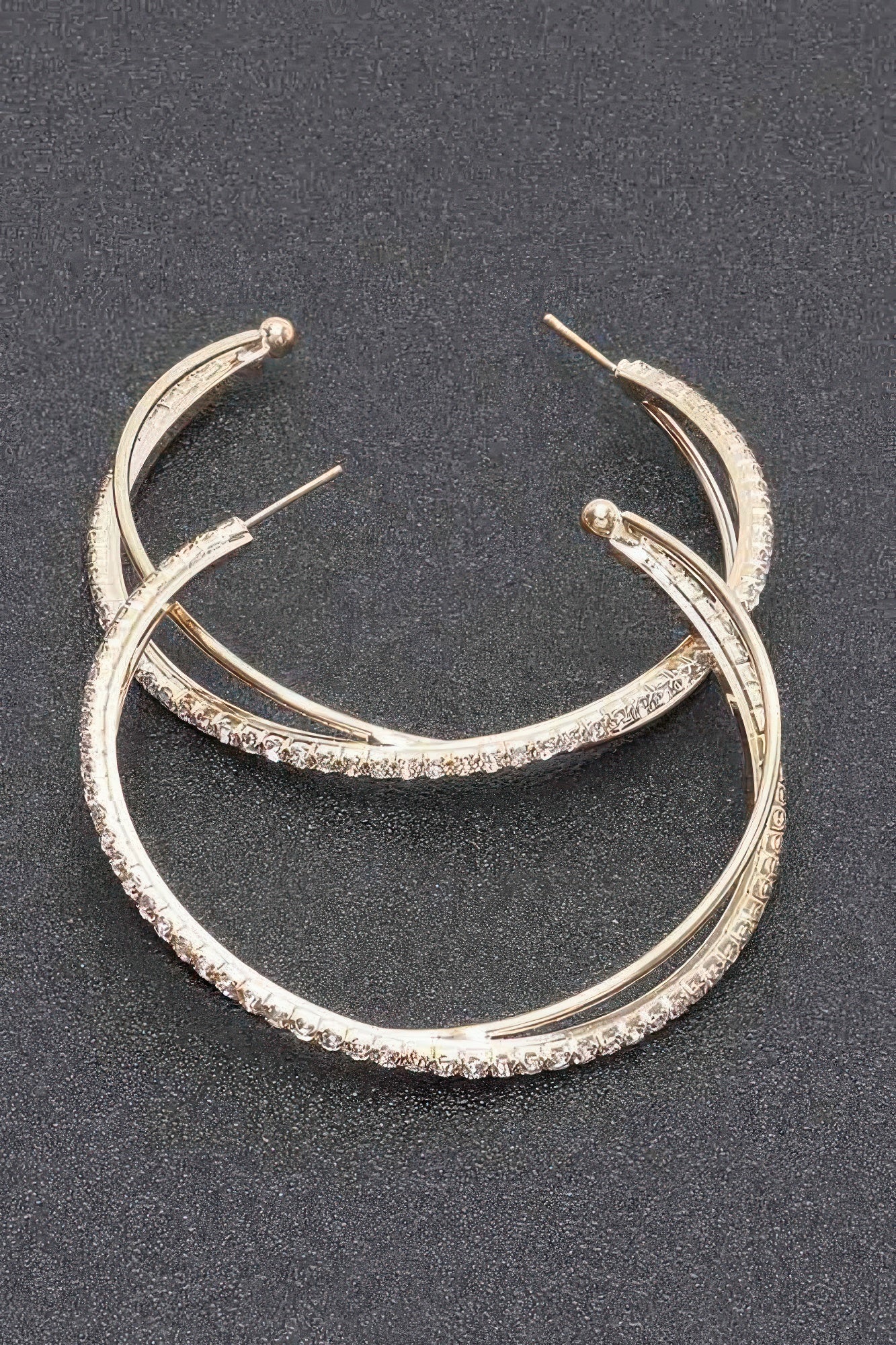 Rhinestone hoop earrings, gold-toned hoops with clear stones across the band