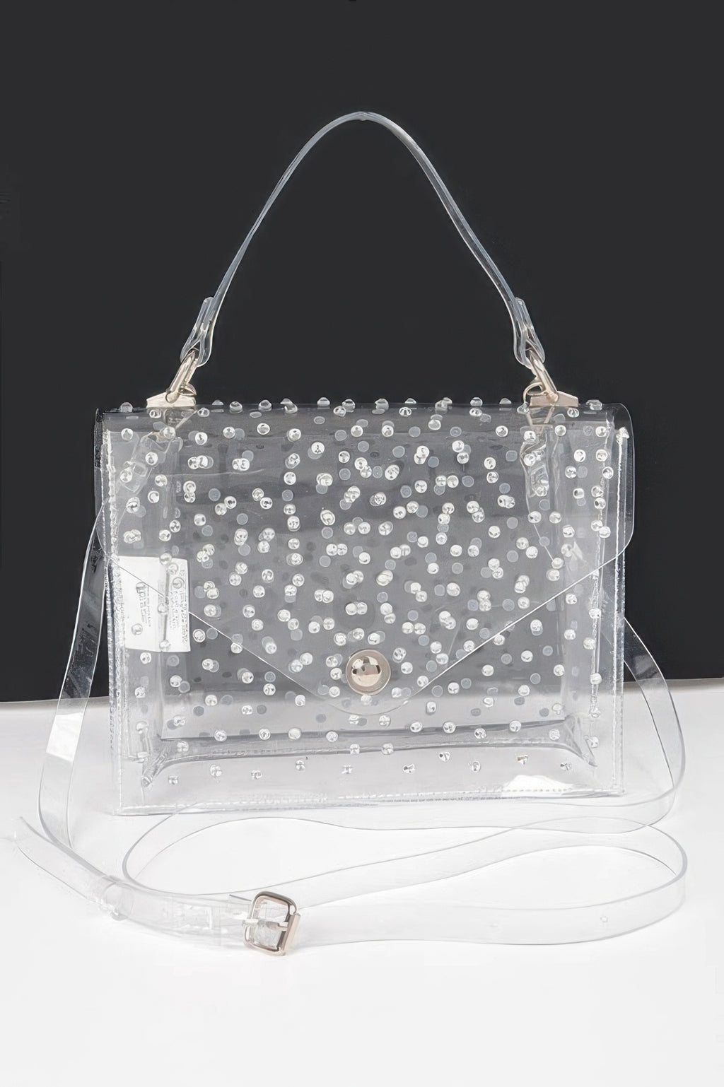 Clear silver rhinestone hot-fix crossbody bag with top handles and flap front.