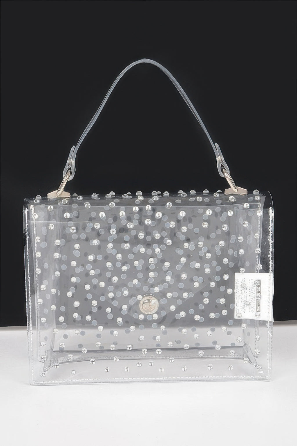Clear silver rhinestone crossbody bag, front flap with round clasp and label pocket.
