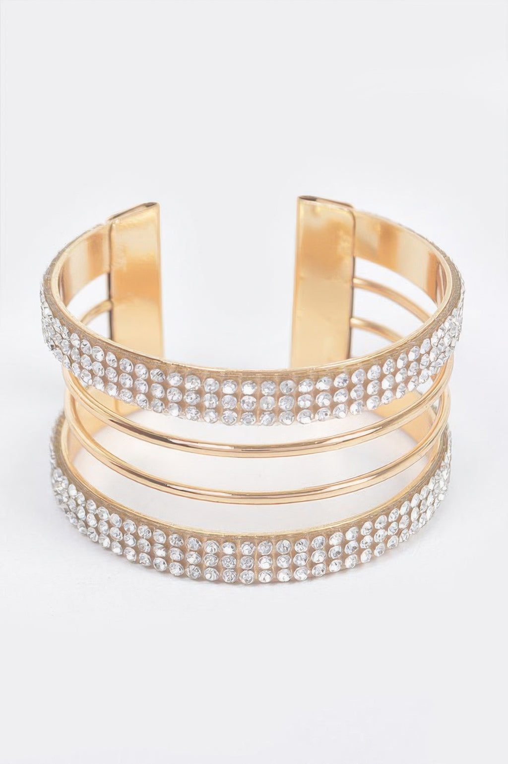 Goldfarbener Rhinestone-Cuff mit zwei Metallreihen und funkelnden Steinen