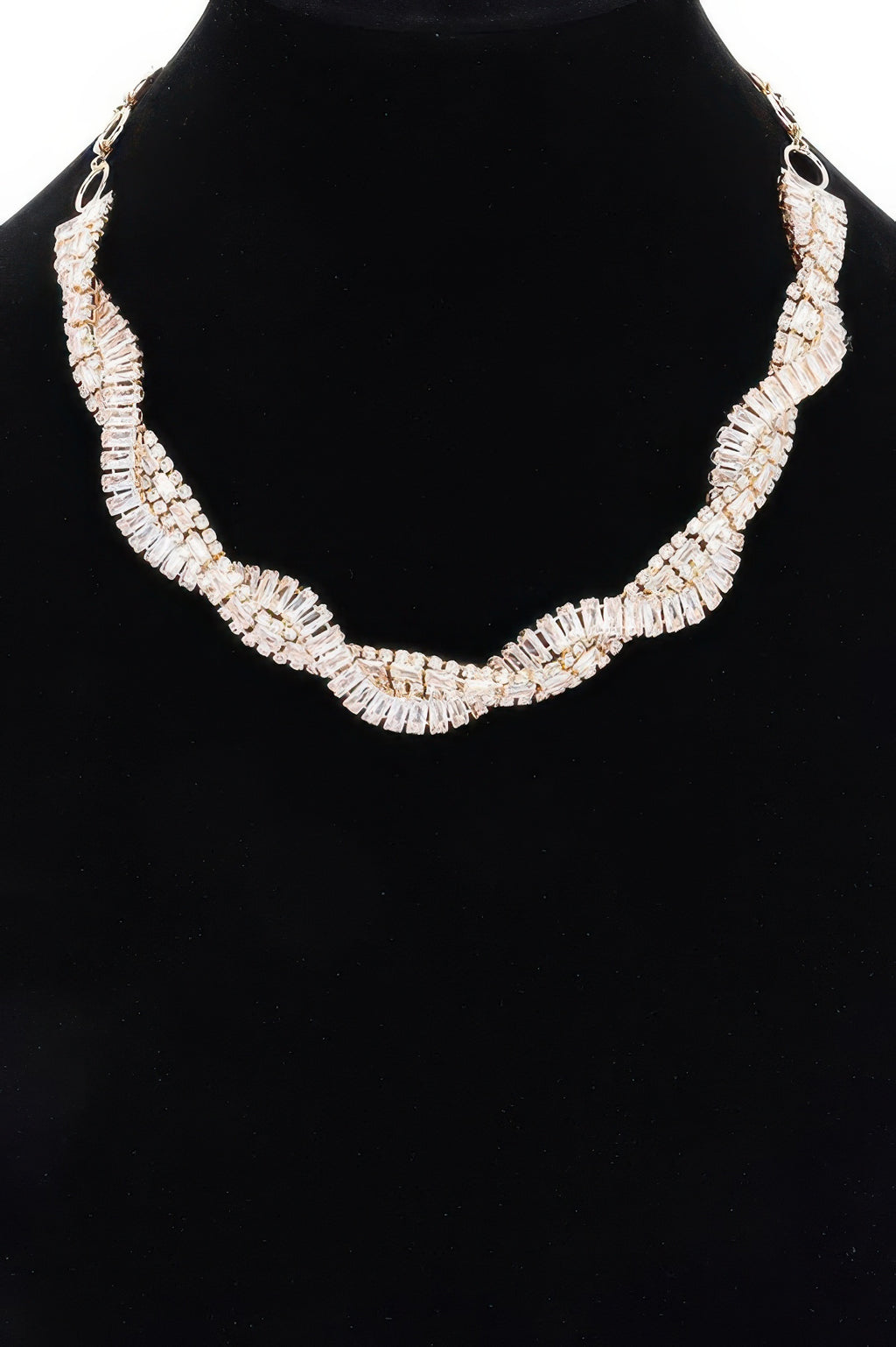 Rhinestone necklace with clear baguette stones in a curved ribbon pattern