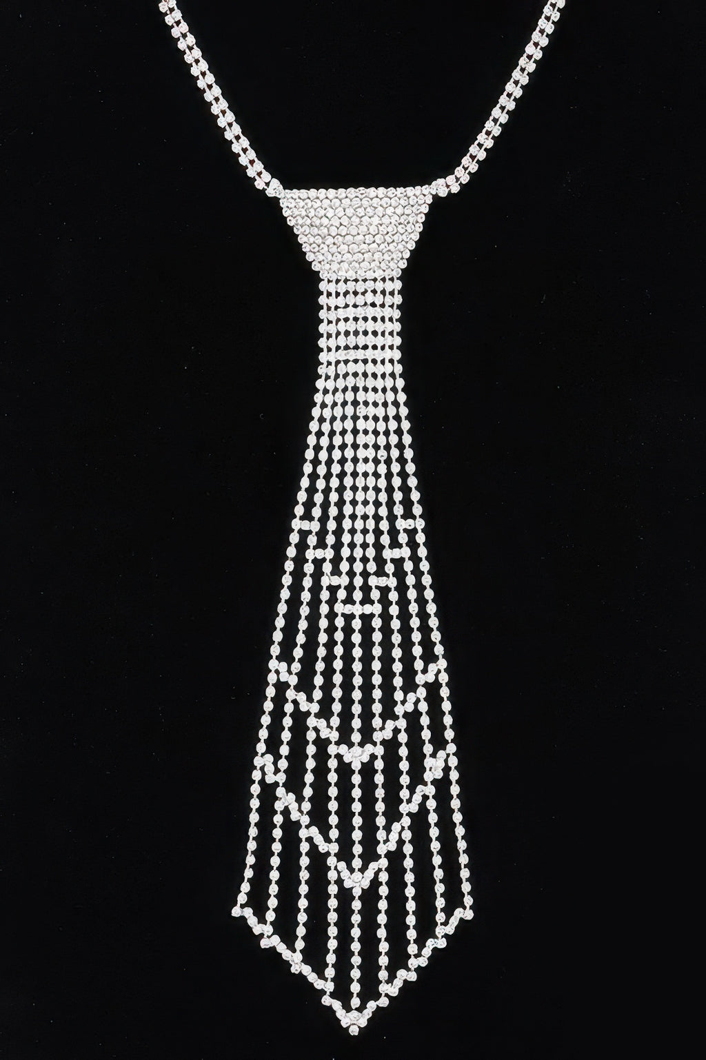 Silver rhinestone necklace with curved chain and draped bead tassel