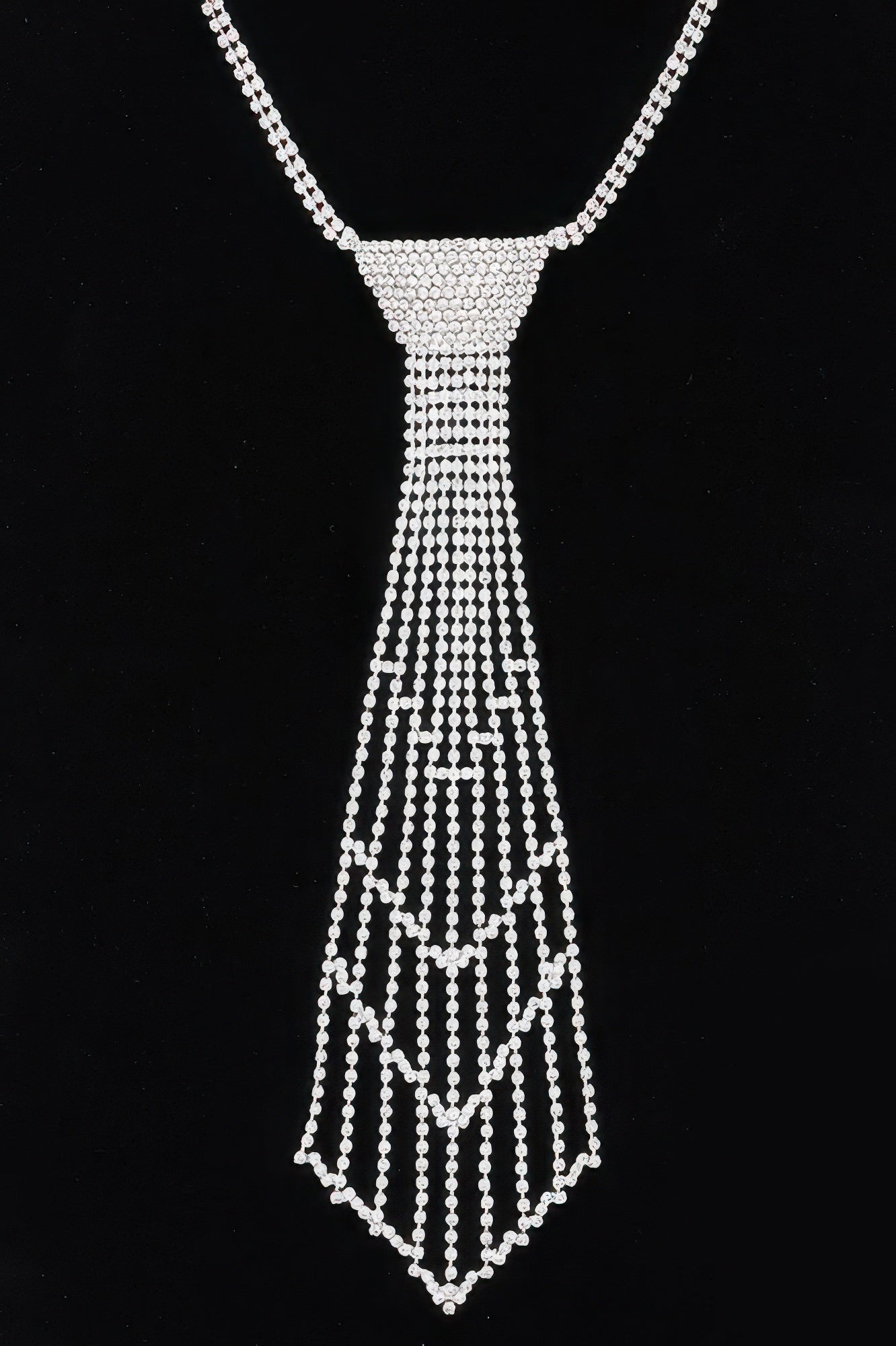 Silver rhinestone necklace with curved chain and draped bead tassel