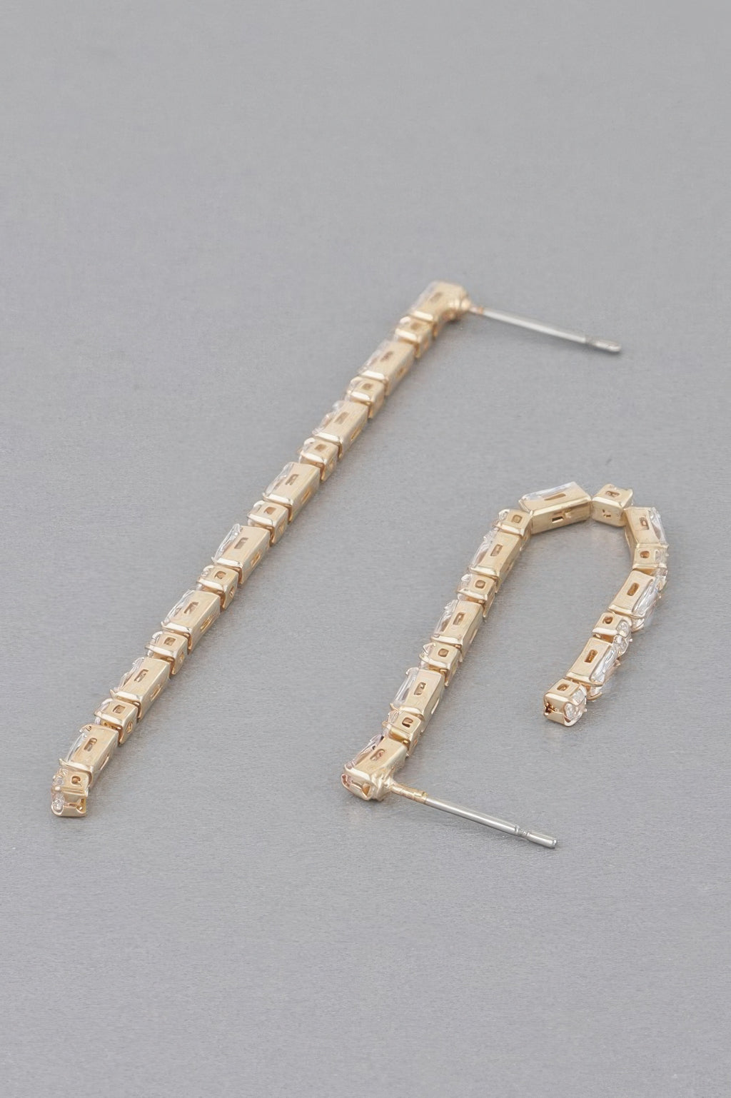 Gold rhinestone drop earrings, curved row of square clear stones, thin post
