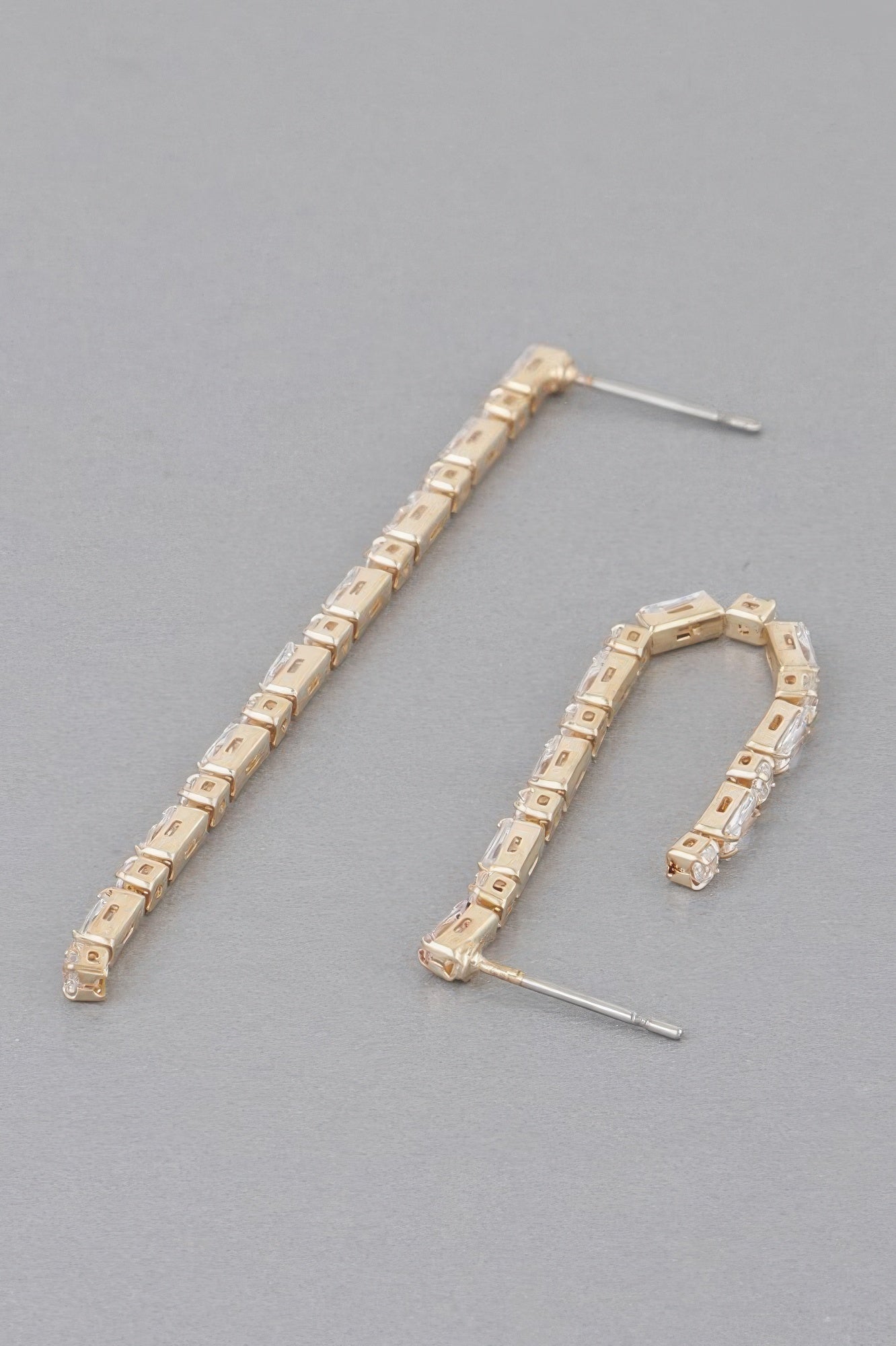 Gold rhinestone drop earrings, curved row of square clear stones, thin post