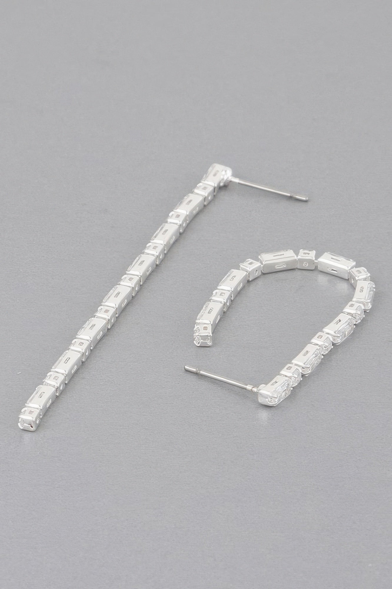 Rhinestone drop earrings in silver tone with long row of square clear stones