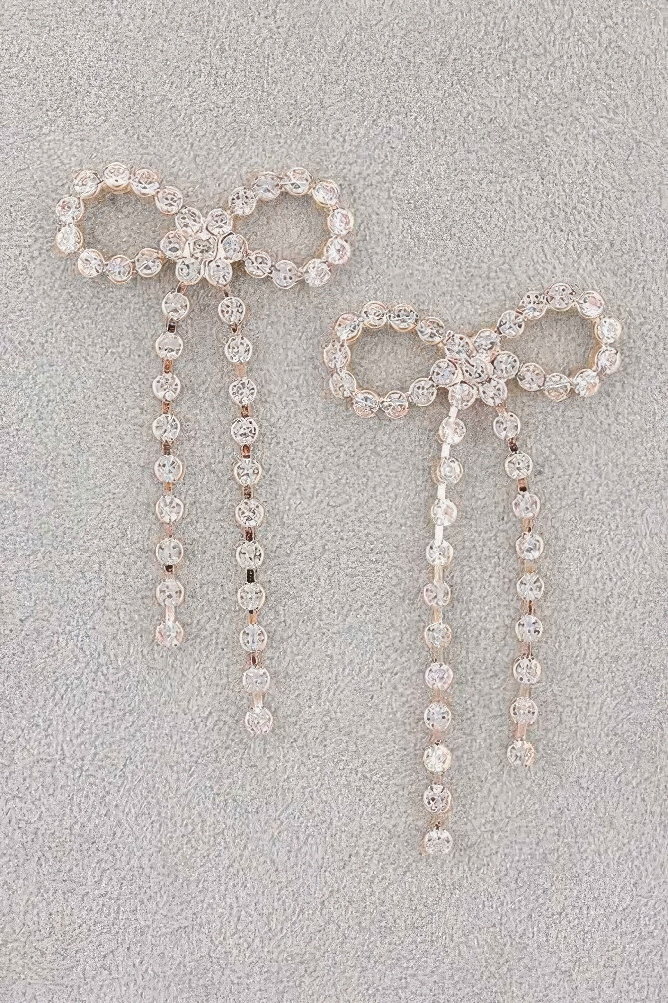 Silver rhinestone ribbon earrings with long dangling drop chains