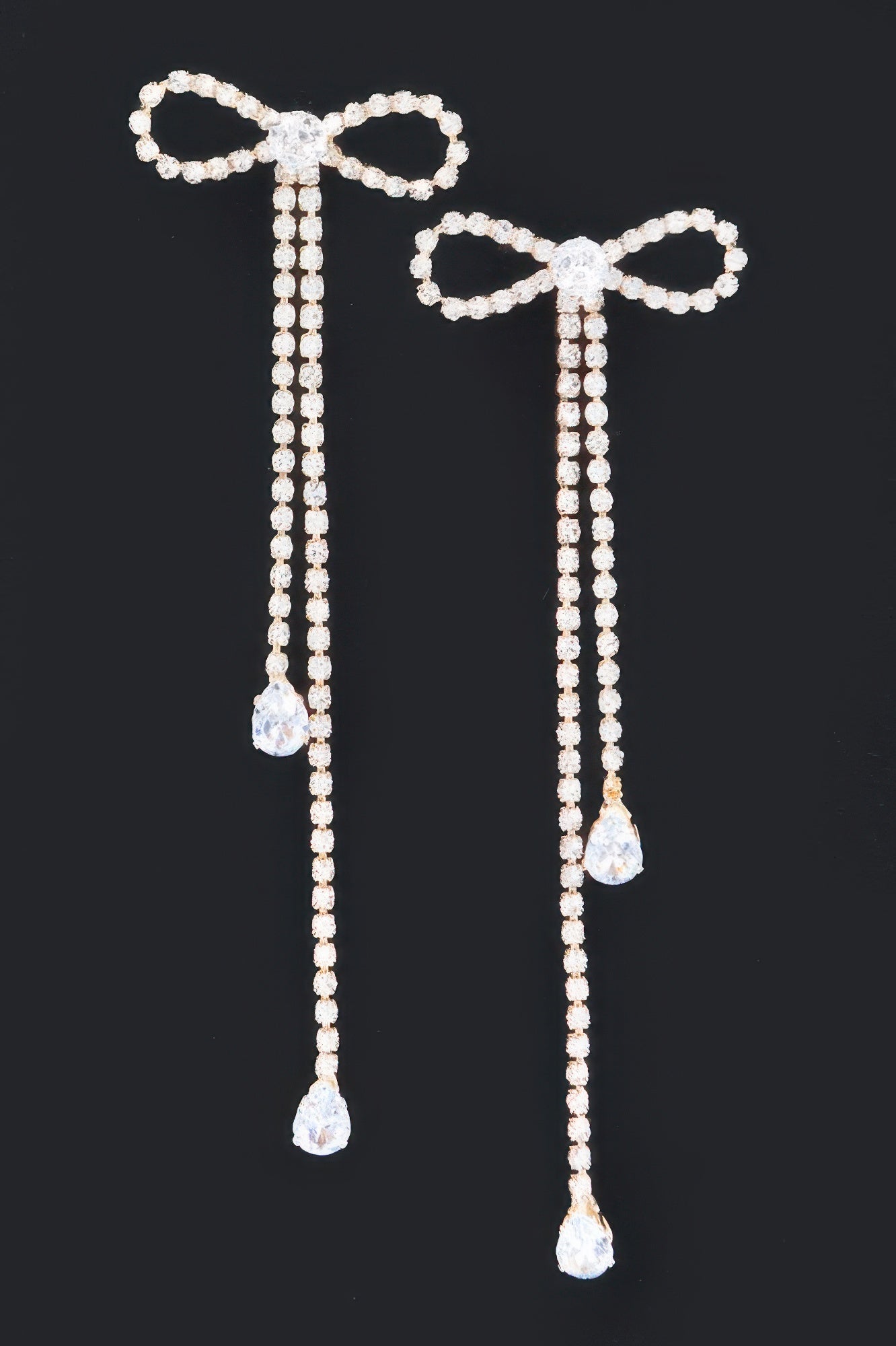Rhinestone ribbon drop earrings, bow detail and three teardrop stones on each