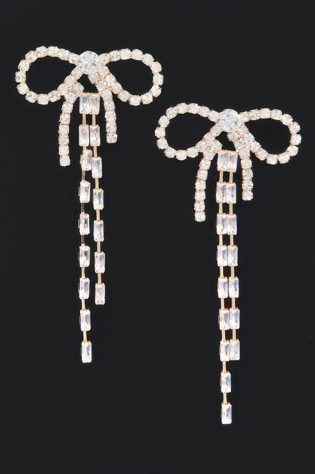 Silver rhinestone ribbon earrings with dangling chain tassels and square crystal blocks
