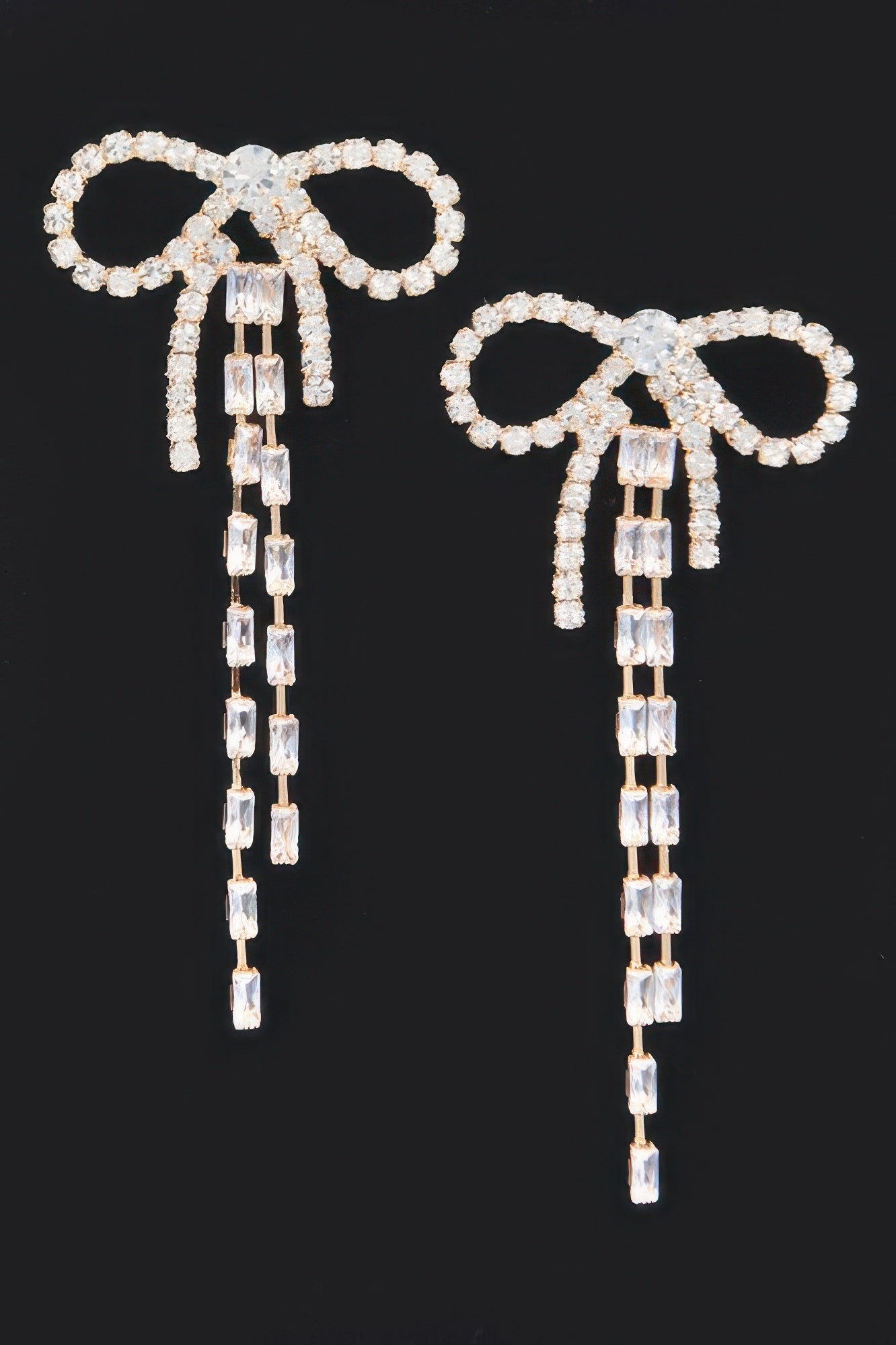 Silver rhinestone ribbon earrings with dangling chain tassels and square crystal blocks