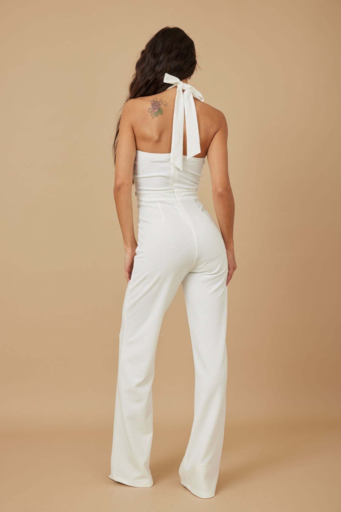 White halter ribbon jumpsuit back view with neck tie and open back keyhole