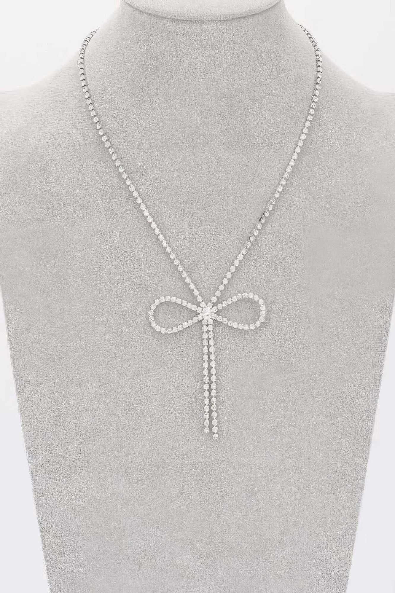 Rhinestone ribbon necklace on bust: bow pendant with dangling rhinestone ribbon