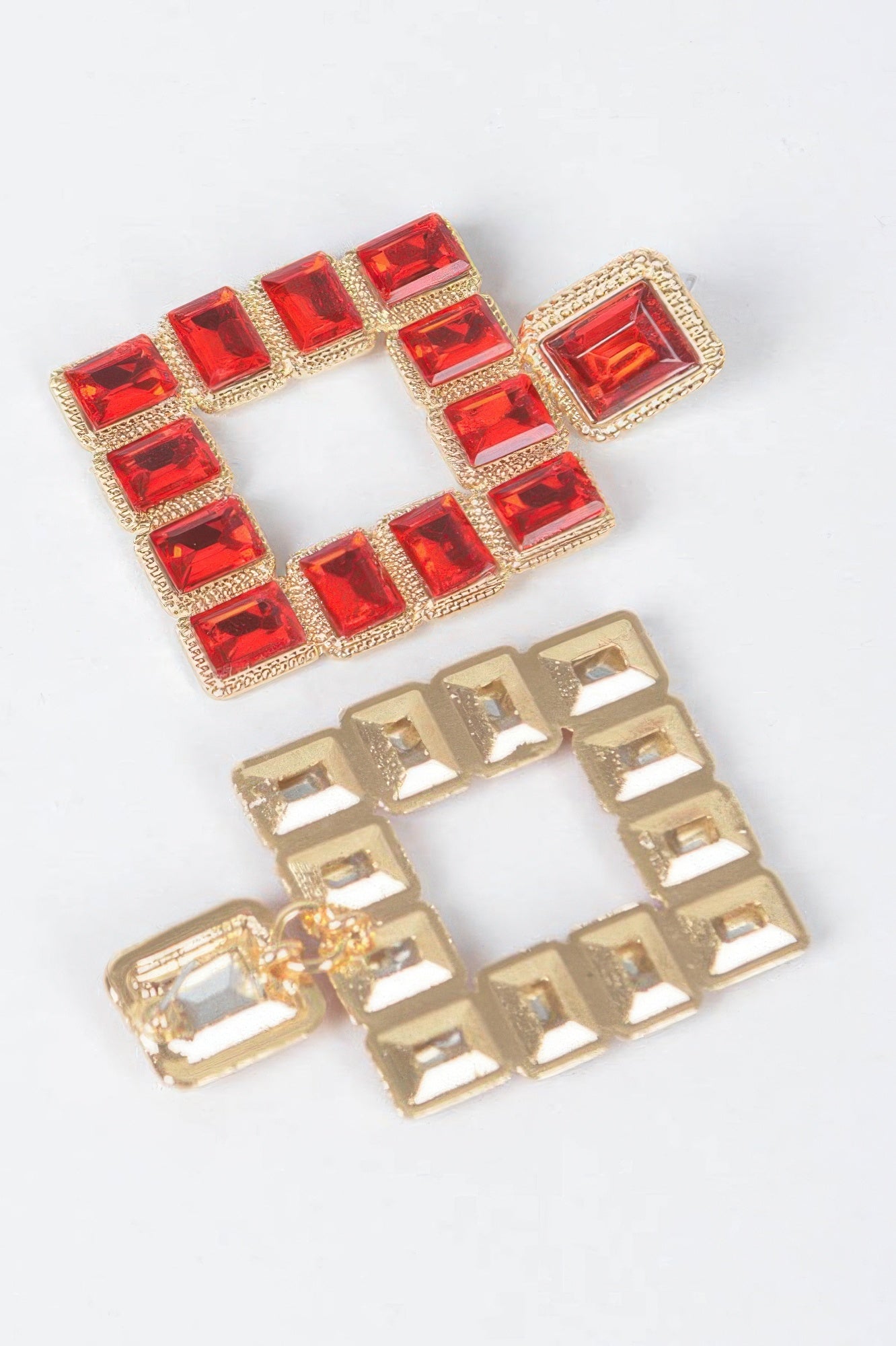 Square rhinestone earrings, red stones and gold-tone frame detail