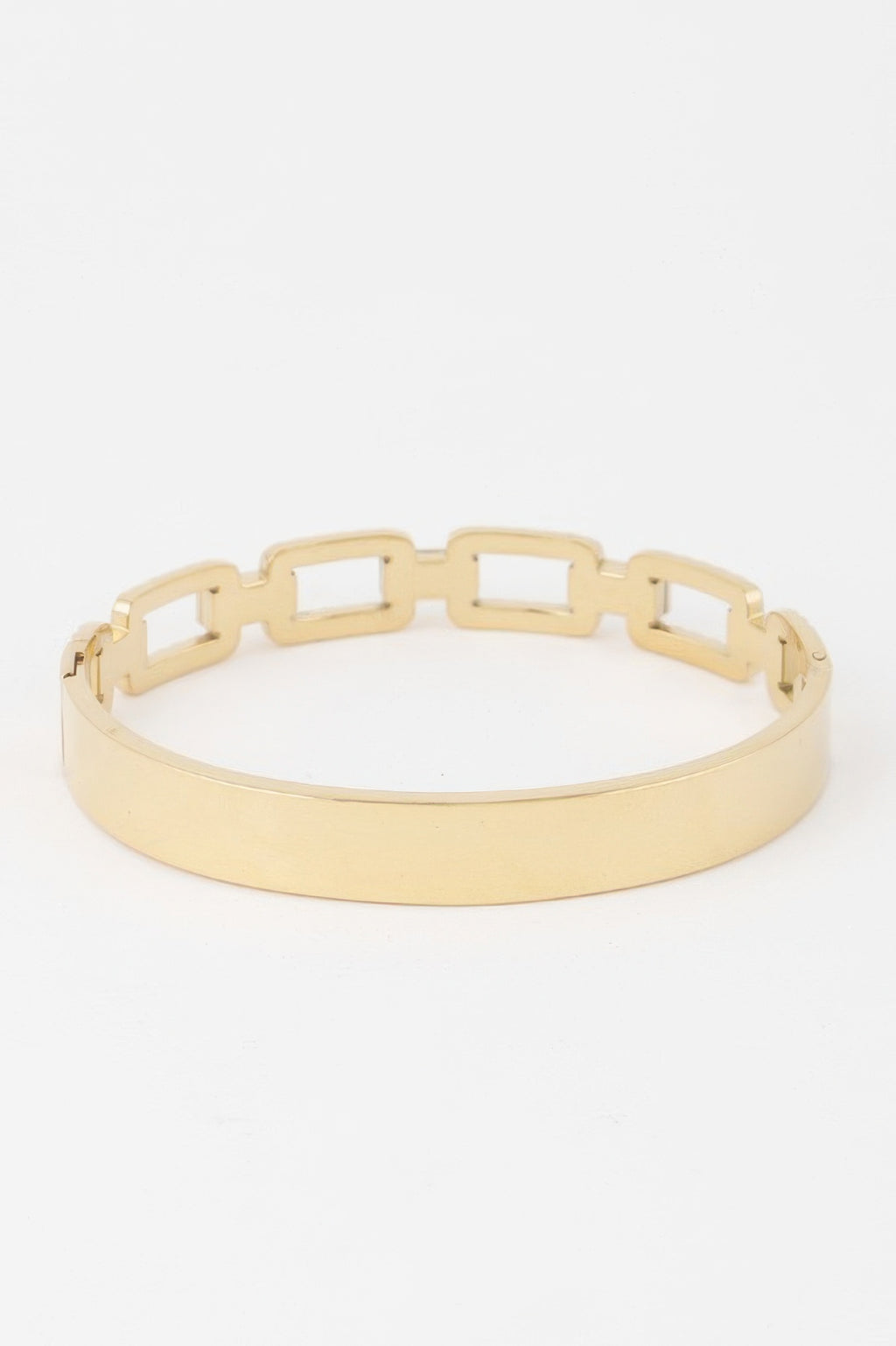 Gold ribbed chain bracelet with square cutout links and open hinged clasp