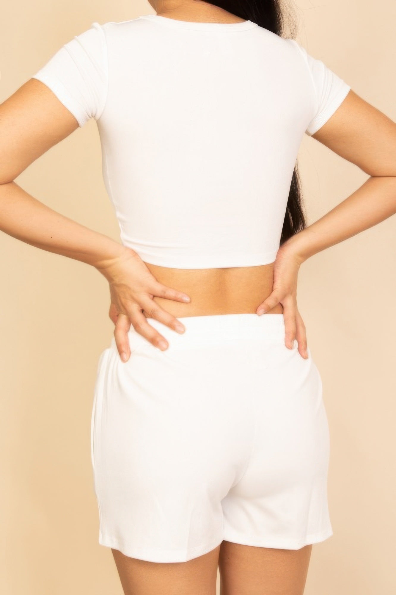 White ribbed knit lounge shorts, elastic waist with drawstring, back view