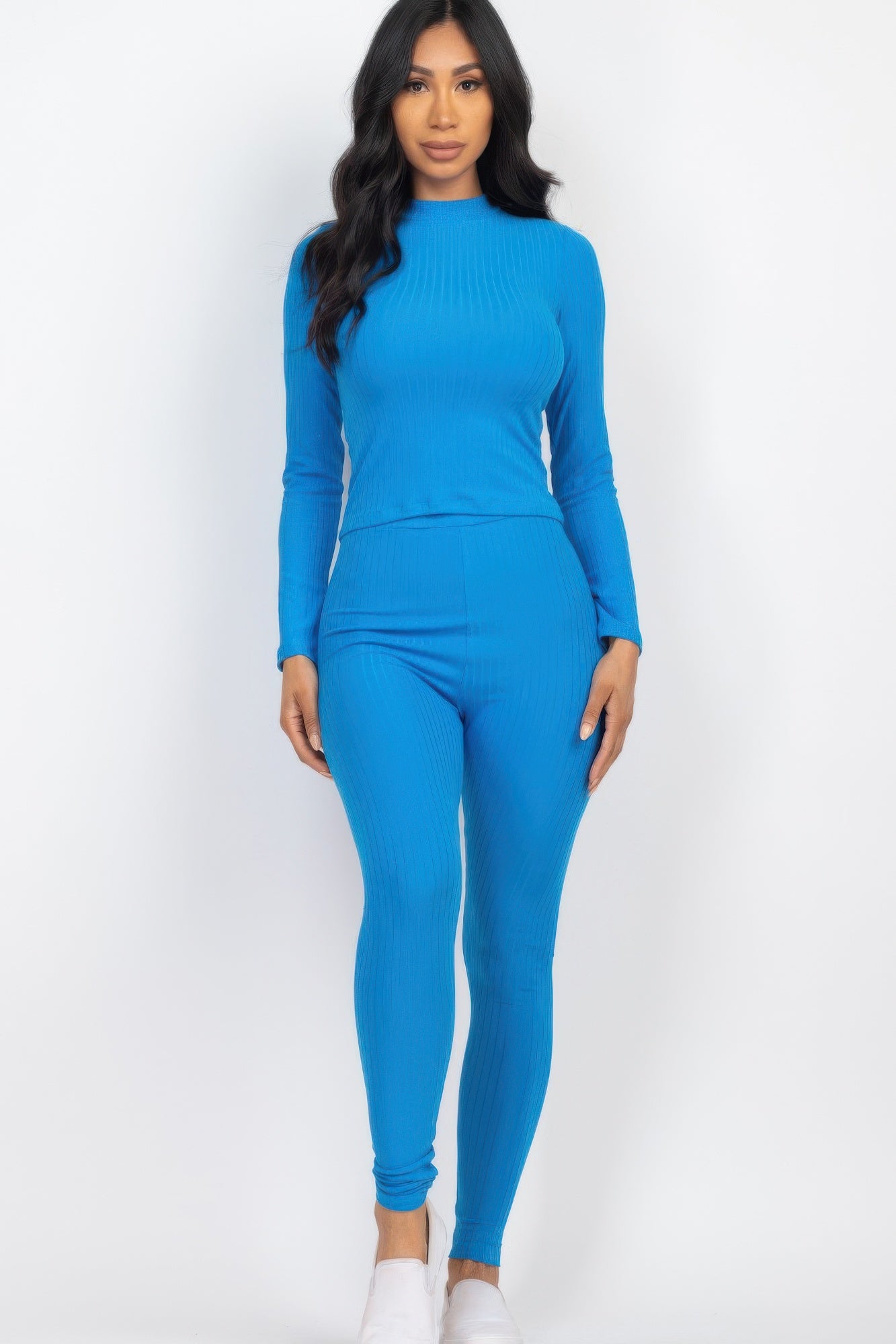 Bright blue ribbed mock neck long-sleeve top with matching high-waist leggings.