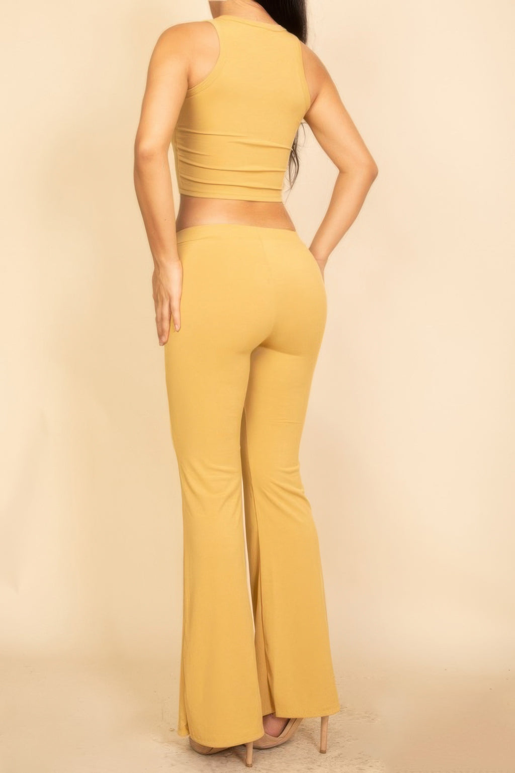 Back view: yellow ribbed sleeveless crop top with matching flared pants