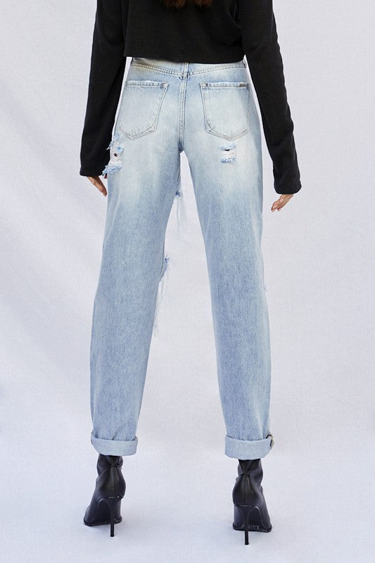 Light baggy jeans back view with distressed knee rips and cuffed hems