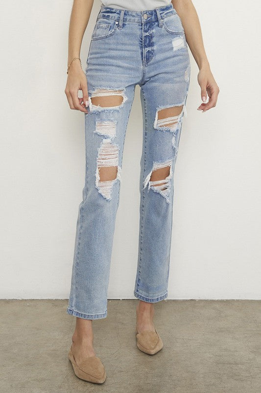 Light wash ripped boyfriend jeans with knee/thigh distressed rips