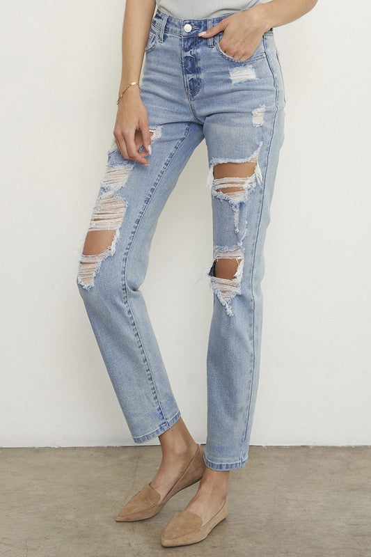 Light wash ripped boyfriend jeans, low-rise waist with multiple front leg rips