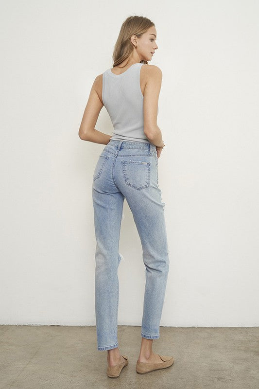 Light wash boyfriend jeans, back view with subtle rips near pockets and hem