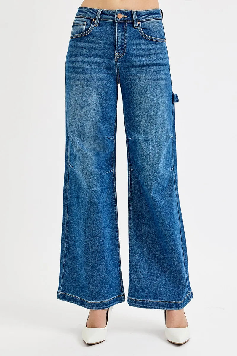 Wide-leg high-rise jeans in dark denim with button fly and patch pockets