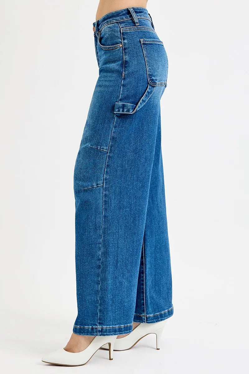 Side view high-rise wide-leg jeans with belt loops and flap pocket on the leg