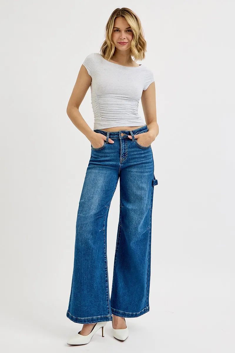 Full-length high-rise wide-leg jeans in dark denim with patch-pocket styling