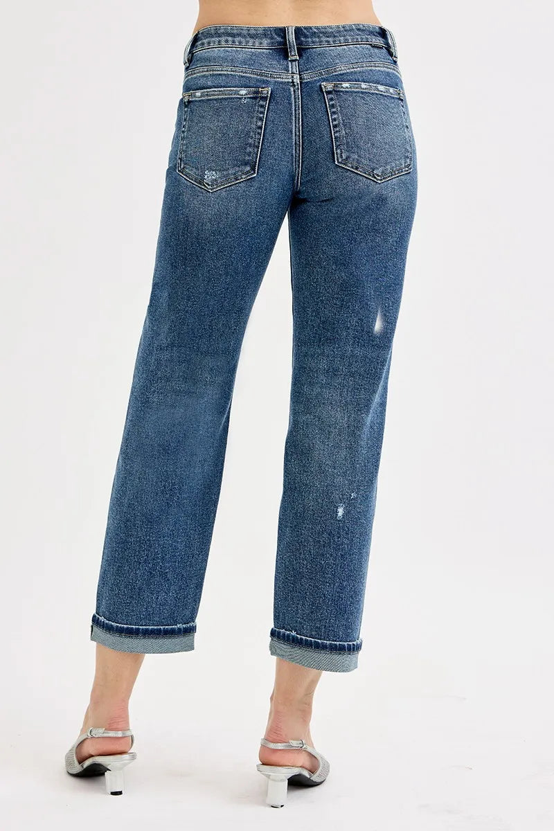 Back view of boyfriend crop jeans, dark blue wash, stitched back pockets and cuffed hem