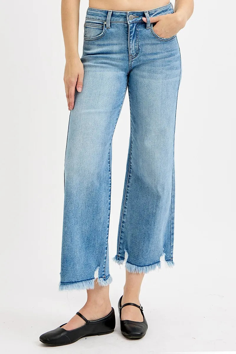 Light-wash mid-rise wide-leg jeans with front seam, belt loops, and frayed cuffs