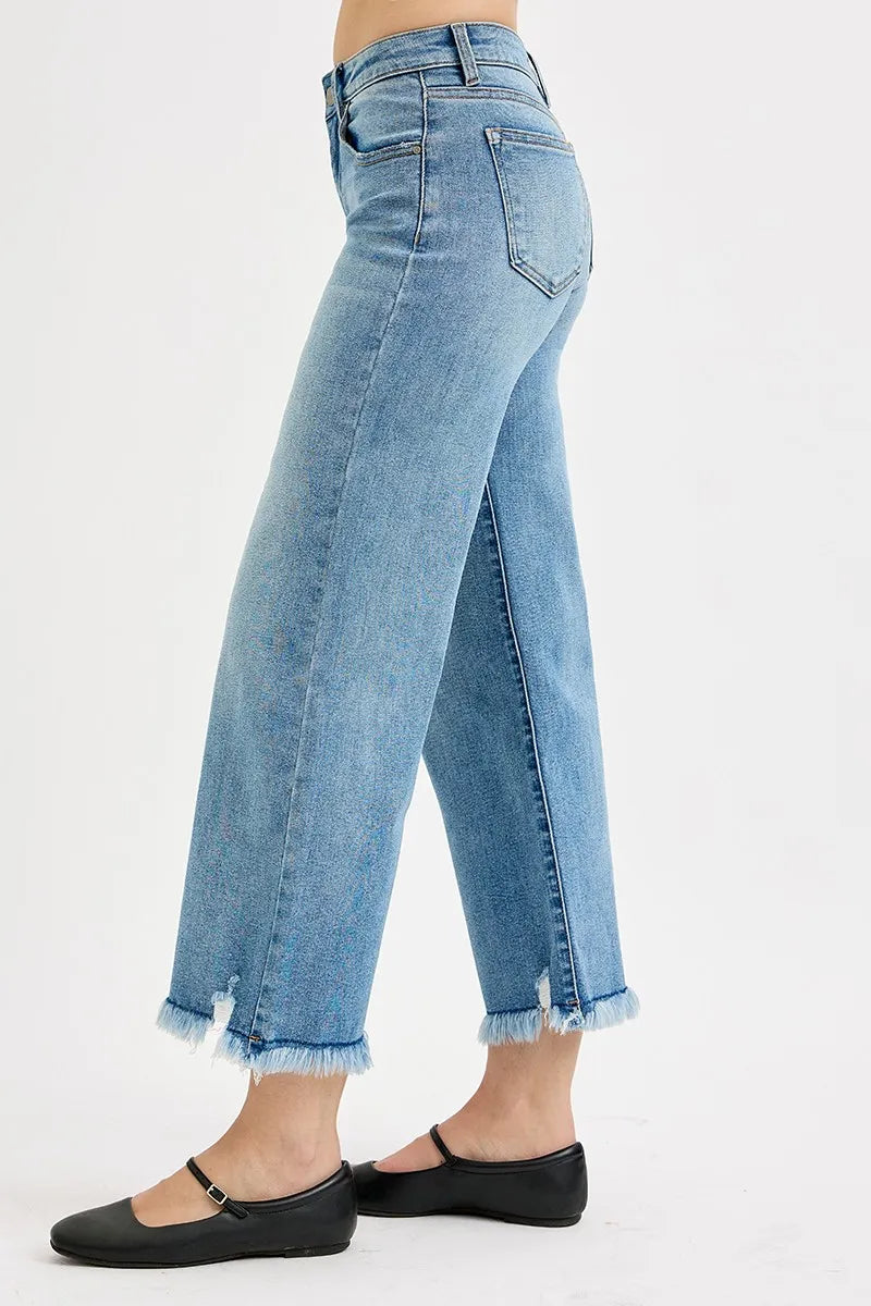 Light-wash wide-leg crop jeans with side seam detail and frayed ankle hem