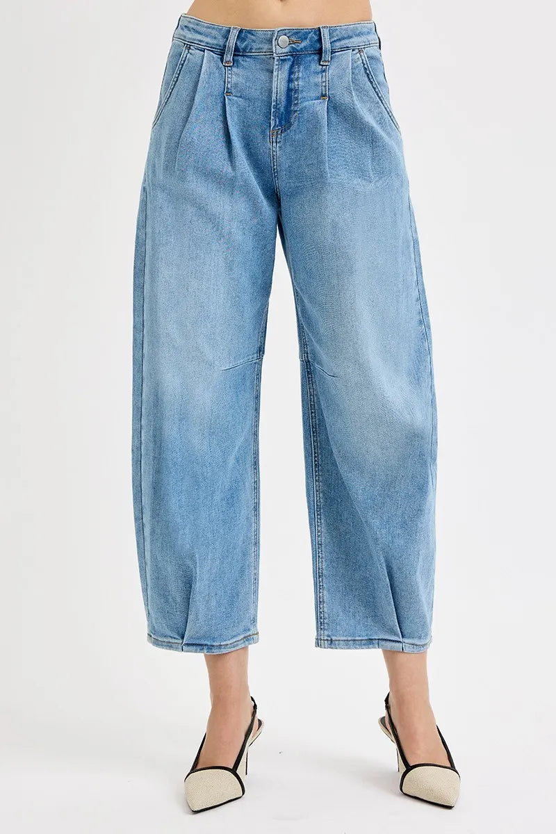Medium-wash mid-rise crop wide-leg jeans, draped leg opening and stitched seams