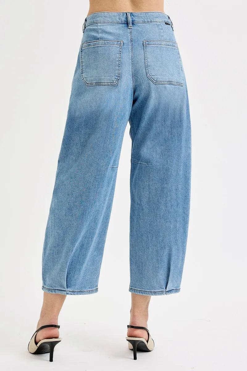 Back view of medium-wash mid-rise crop wide-leg jeans with two back pockets