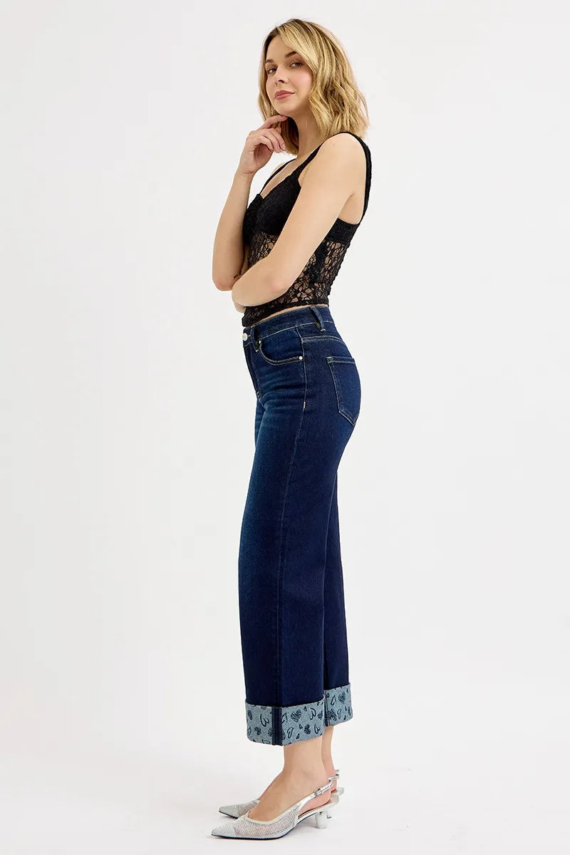 Dark blue wide-leg cropped jeans with mid rise and printed cuff hem detail