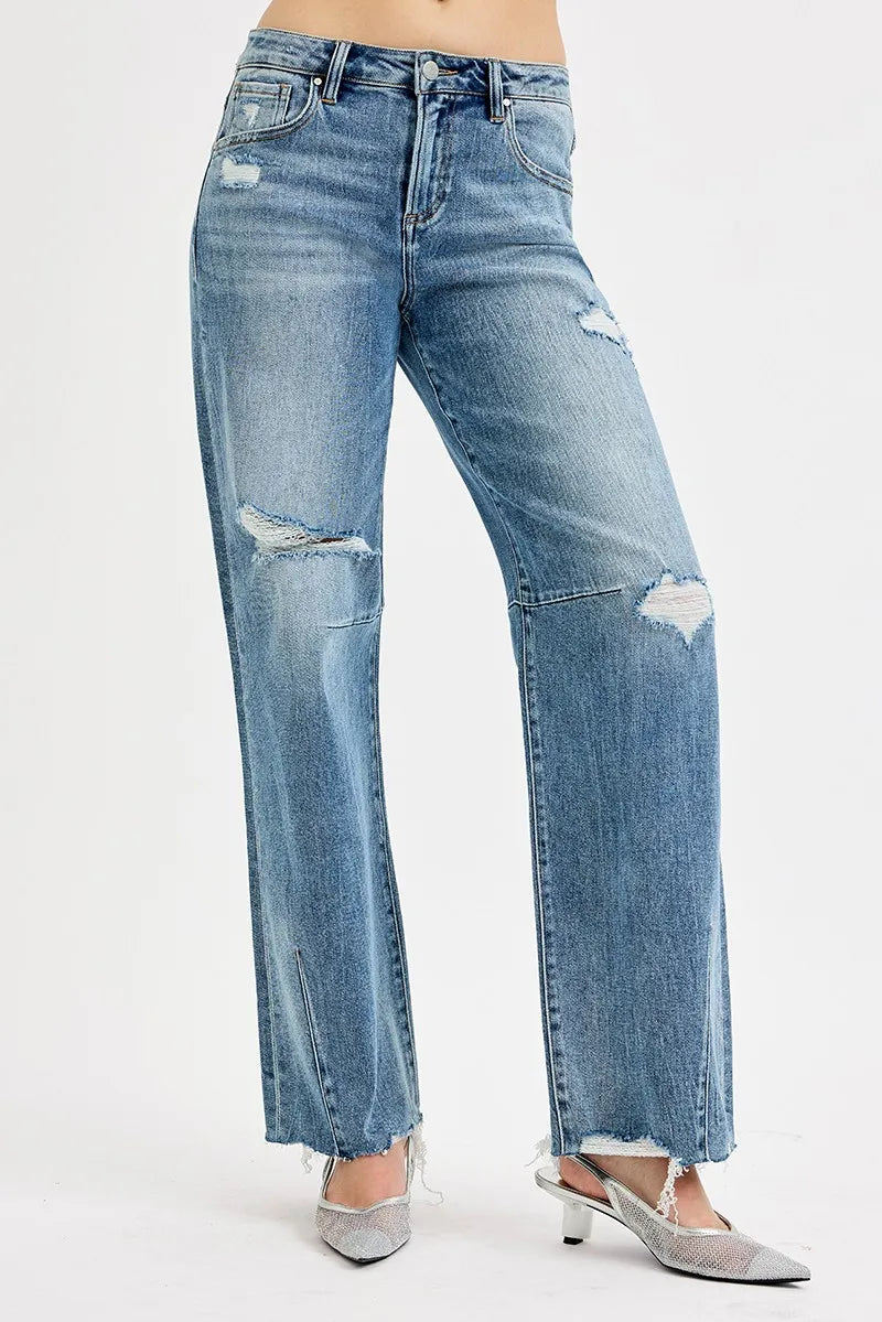 Wide-leg denim jeans with distressed thigh and knee patches, frayed ankle hem