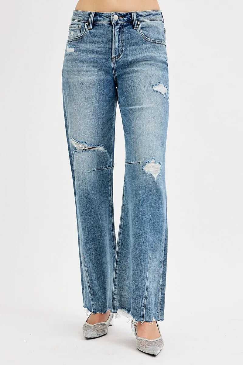 Back view medium wash wide-leg jeans with patchwork rips and frayed cuffs