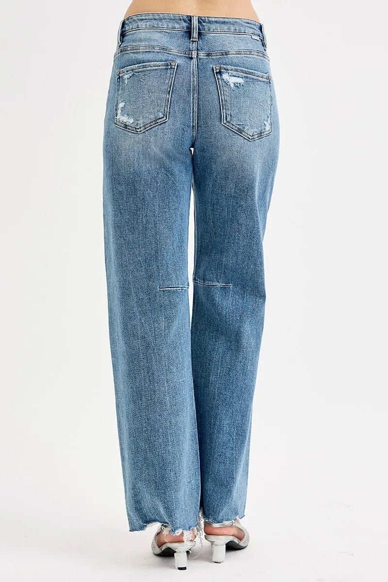 Back view medium wash wide-leg jeans with button pockets and distressed panels