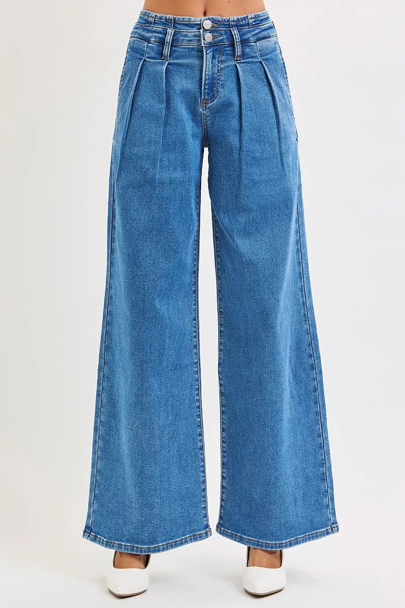 Medium wash denim jeans, mid-rise wide leg with pleated front and button waist