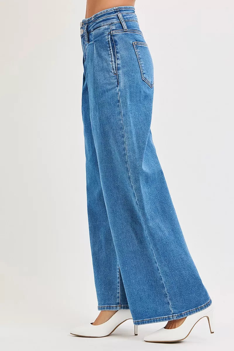 Side view medium wash wide-leg denim jeans with belt loops and stitched details