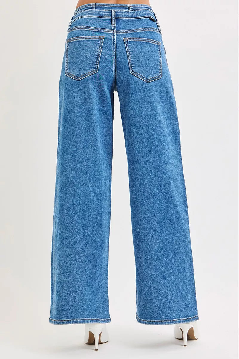 Back view medium wash wide-leg jeans with two button-flap back pockets
