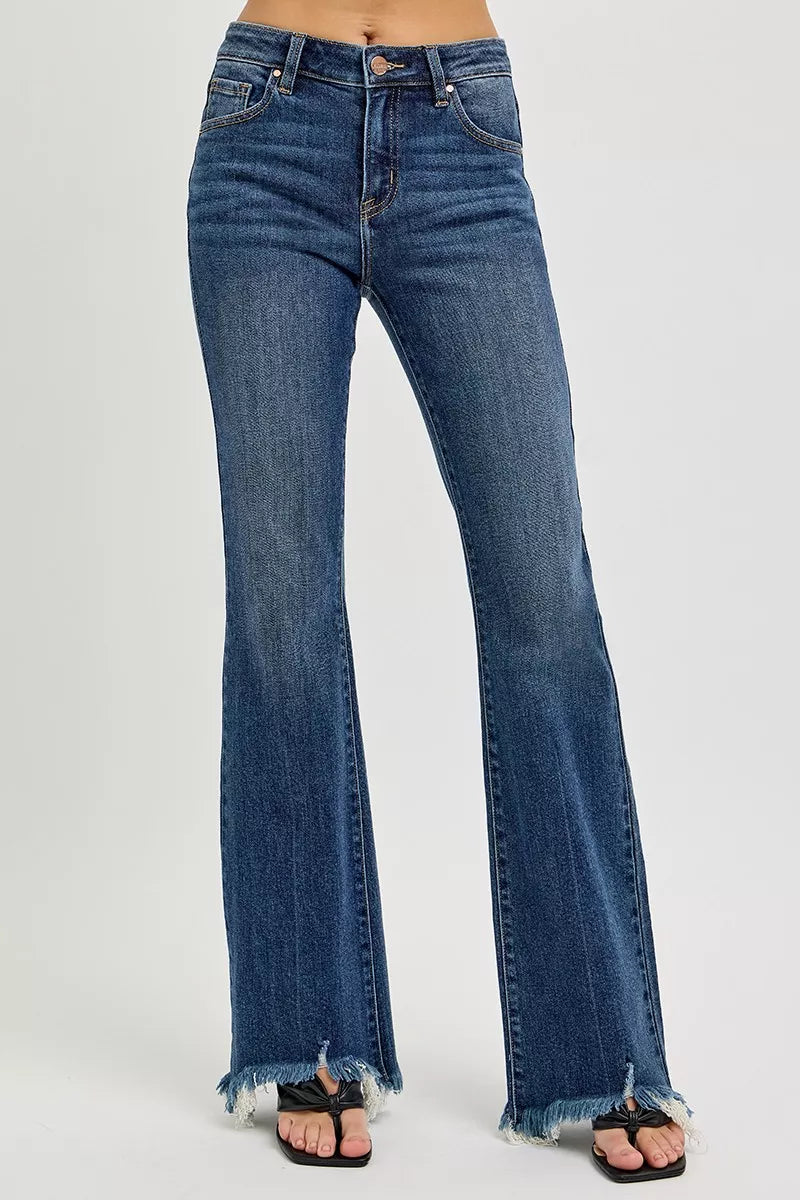Dark wash mid-rise flare jeans with frayed cuffs at the hem.