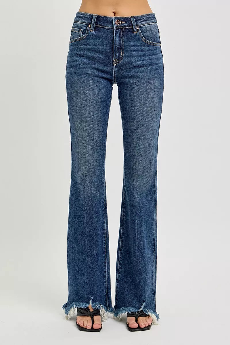 Dark wash mid-rise flare jeans shown from back, with frayed hem.