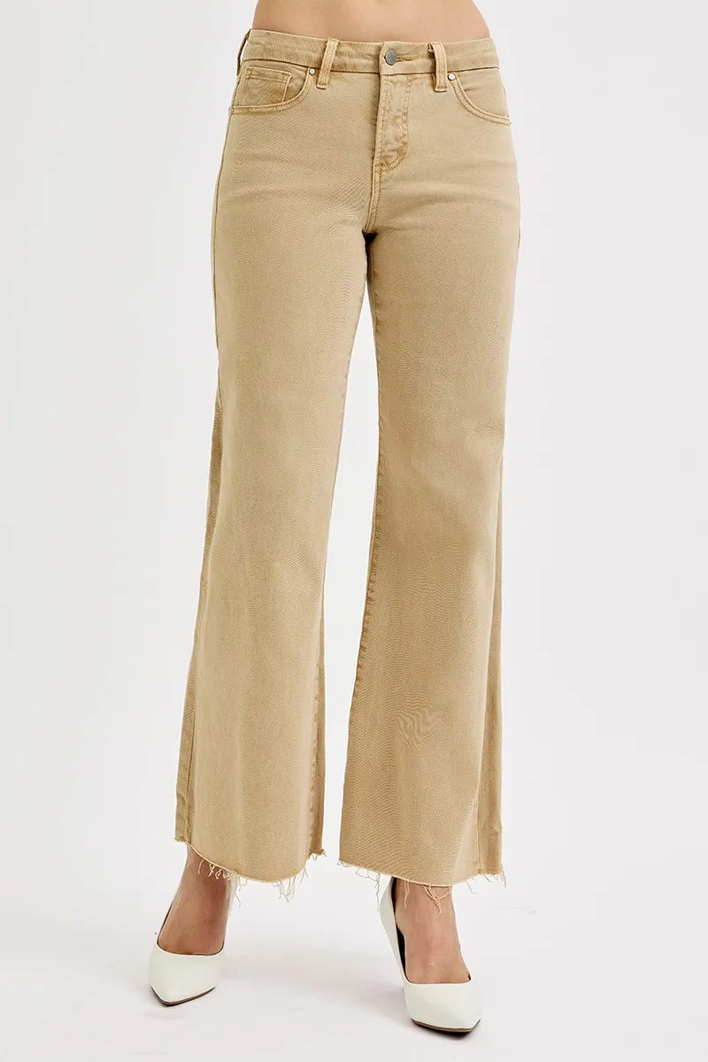 Tan wide-leg jeans with raw hem and button-fly closure