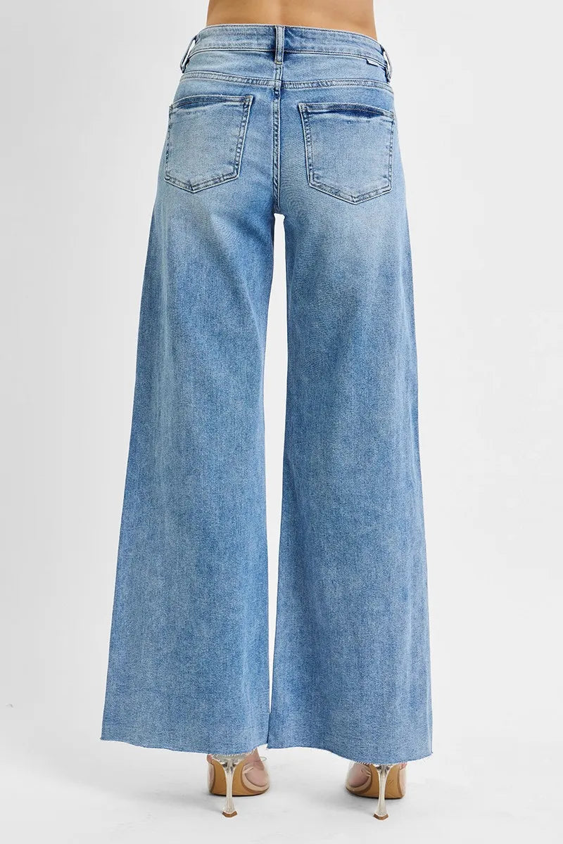 Light wash high-rise palazzo jeans with back pockets and wide straight-leg silhouette