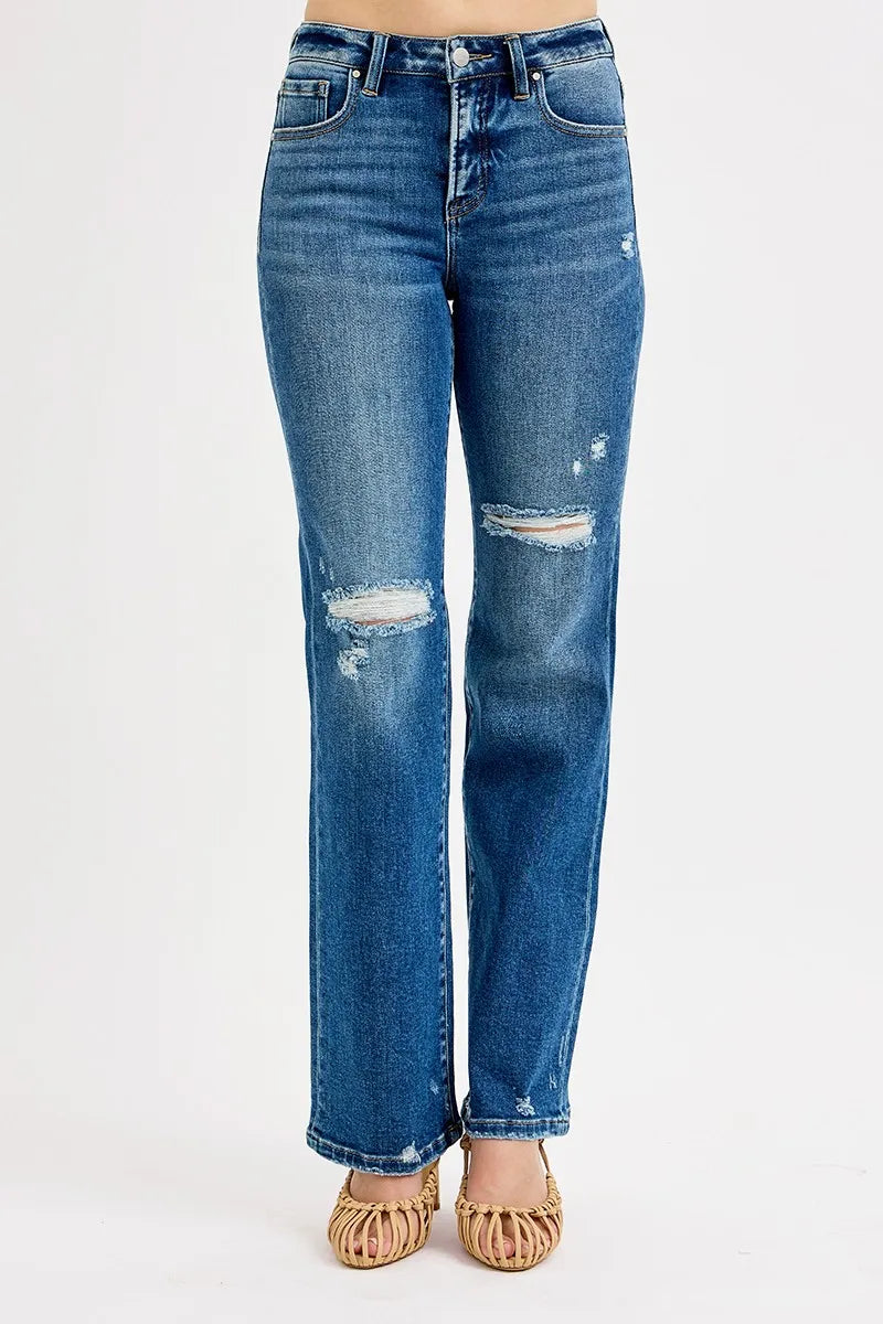 Dark blue straight jeans, high rise waistband, ripped knee and small distressed patches
