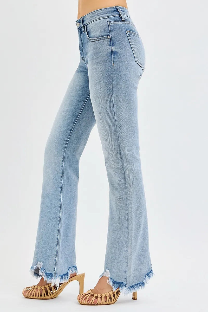 Side view medium wash mid-rise flare jeans with frayed cuffed hem